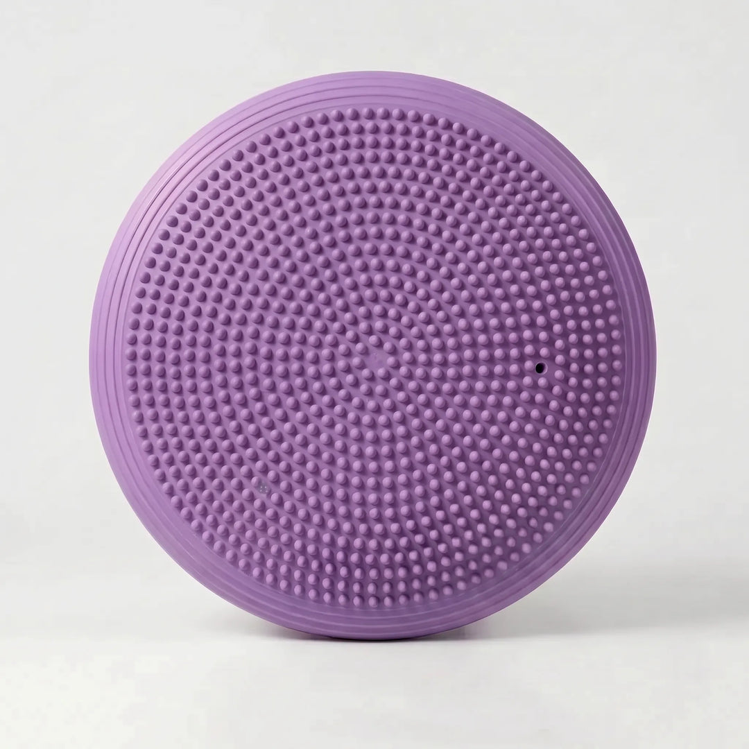 Inflatable balance cushion for core strength, stability, and posture improvement in fitness routines.