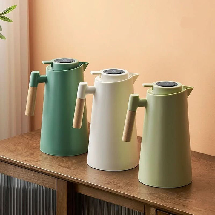 Double-wall insulated carafe with wood handle. Keeps hot drinks warm for 12h, cold drinks chilled for 24h.