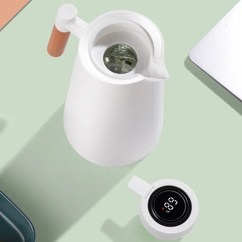 Sleek insulated carafe with natural wood handle & smart LED temperature display. Modern design for kitchen.