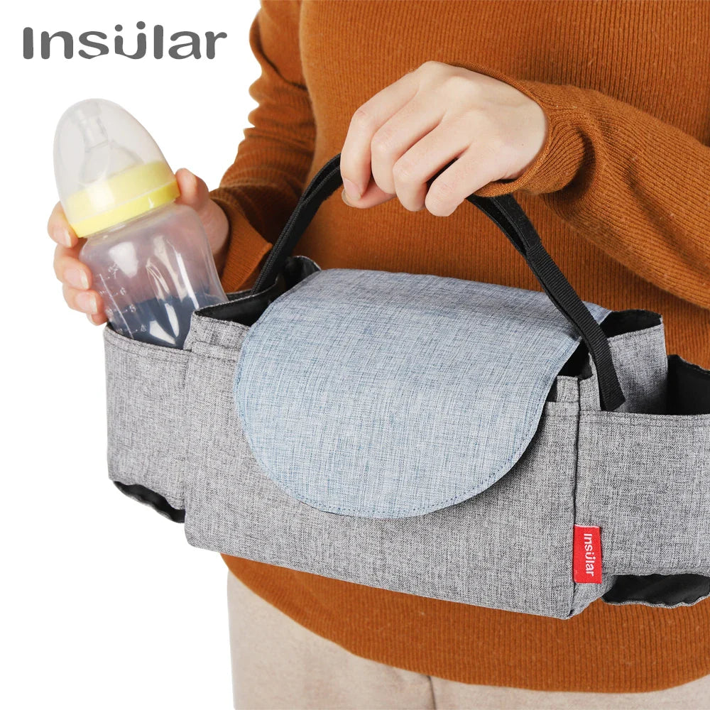 Unisex diaper bag, black polyester, open front revealing spacious interior for baby essentials, maternity.