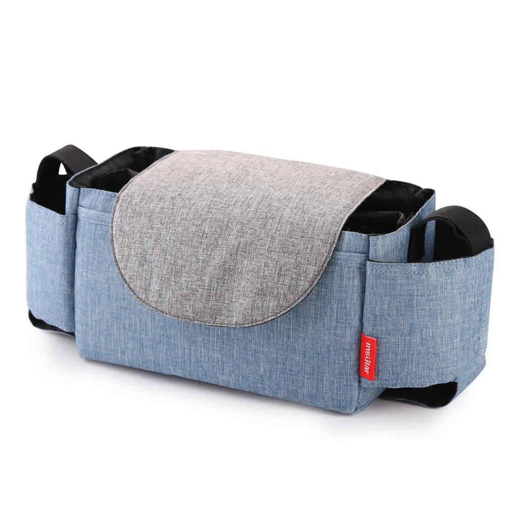 Couple carrying a stylish unisex insulated diaper bag in a park, convenient for baby essentials.