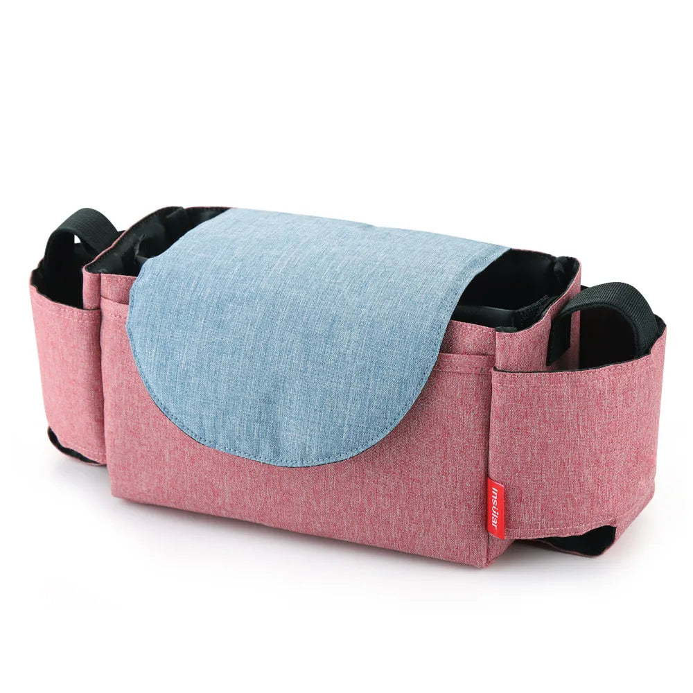 Top-down view of a unisex polyester diaper bag, open to show baby bottles and diapers, maternity.