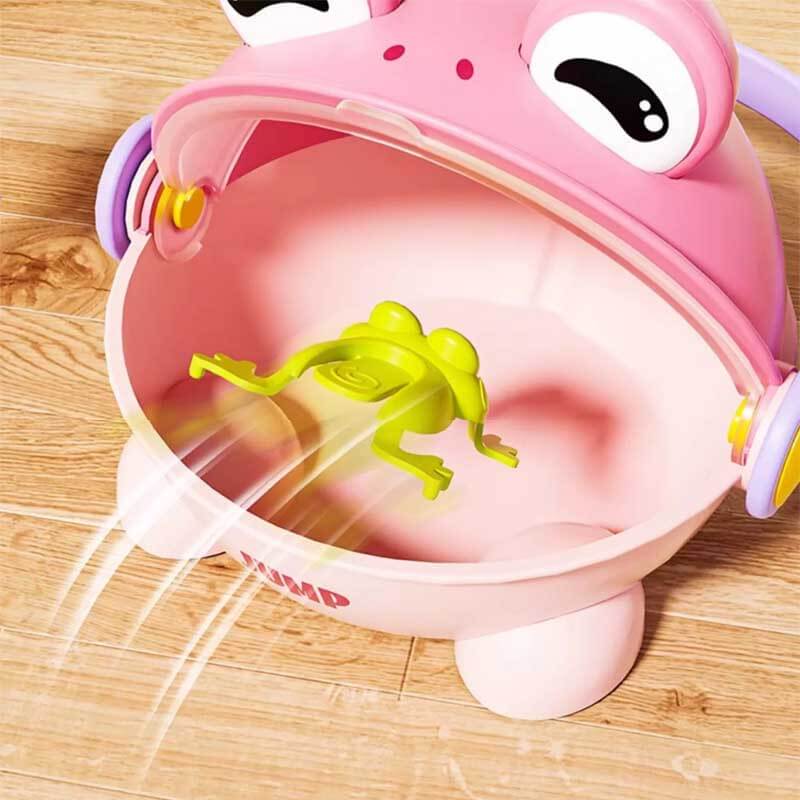 Toddler laughing while playing the jumping frog game, a fun and portable educational activity toy