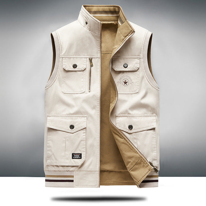 Black unisex utility vest, a stylish and practical layering piece with ample pockets for modern streetwear fashion.