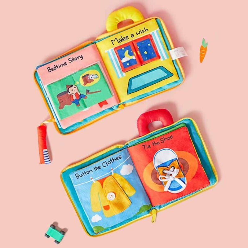 Close-up of an interactive cloth activity book designed for babies, featuring sensory play elements