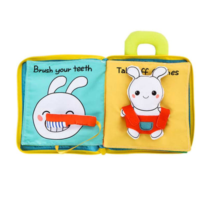 Infant exploring pages of a soft activity book, a perfect educational toy for sensory stimulation