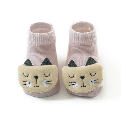 Collection of colorful kids animal socks for babies, showing various anti-slip designs.
