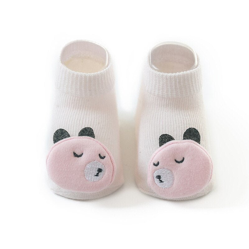 Unisex baby socks with adorable animal faces, designed for comfort and preventing slips.