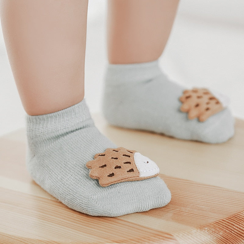 Assorted pack of unisex kids anti-slip socks with different animal patterns for daily wear.