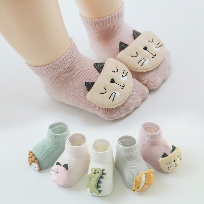 Child's foot wearing a unisex animal anti-slip sock, demonstrating the secure grip.