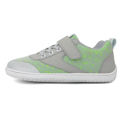 Pair of colorful barefoot sneakers for children, highlighting their flexible, lightweight build.