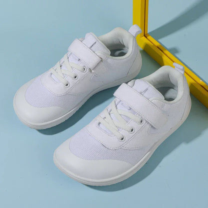 Unisex kids' barefoot running sneakers in bright orange, designed for comfort and flexibility.