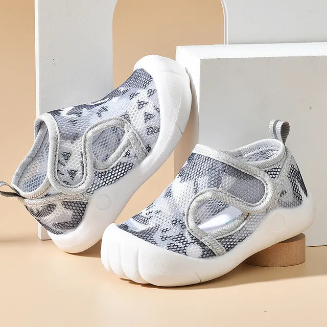 Summer footwear for toddlers, durable anti-slip sole and airy mesh design.