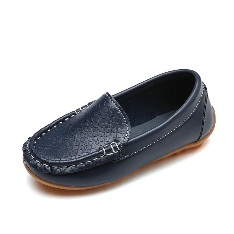Unisex kids' breathable slip-on loafers in a solid color, perfect for casual wear. Anti-slip sole.