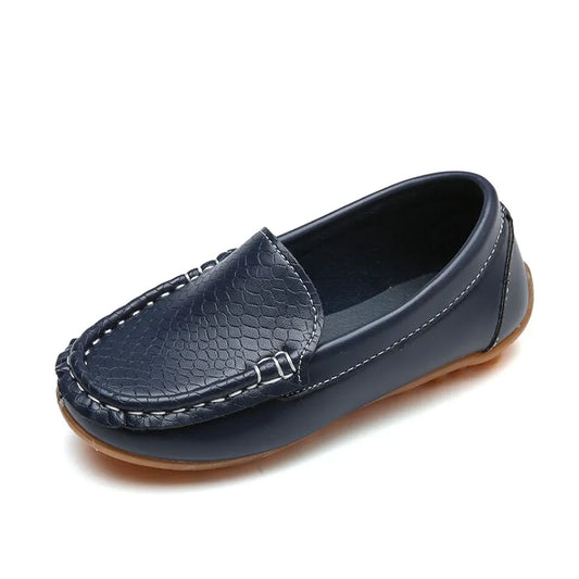 Unisex kids' breathable slip-on loafers in a solid color, perfect for casual wear. Anti-slip sole.