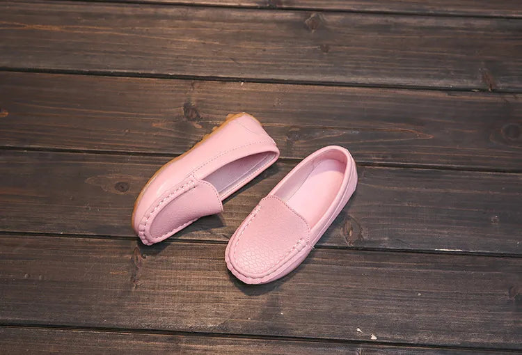 Close-up of the anti-slip sole on a pair of unisex kids' breathable slip-on loafers. Toddler shoes.