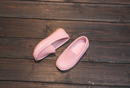 Close-up of the anti-slip sole on a pair of unisex kids' breathable slip-on loafers. Toddler shoes.