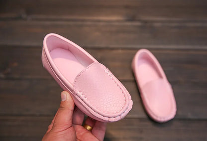 Unisex kids' casual slip-on loafers, designed for breathability and comfort. Children's footwear.