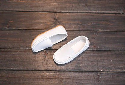 Unisex youth slip-on loafers with a clean, simple design. Breathable fabric for active wear.