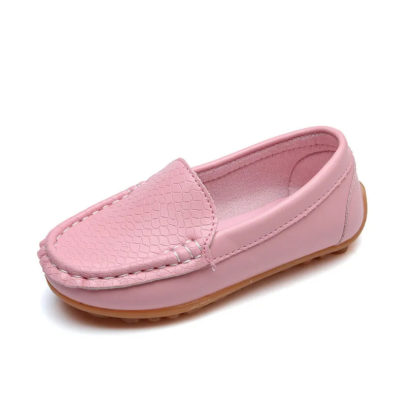 Inside view of a unisex kids' breathable slip-on loafer, showing the soft lining. Comfortable footwear.