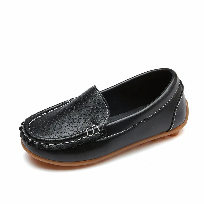 Pair of unisex kids' breathable slip-on loafers on a white background. Easy to wear children's footwear.