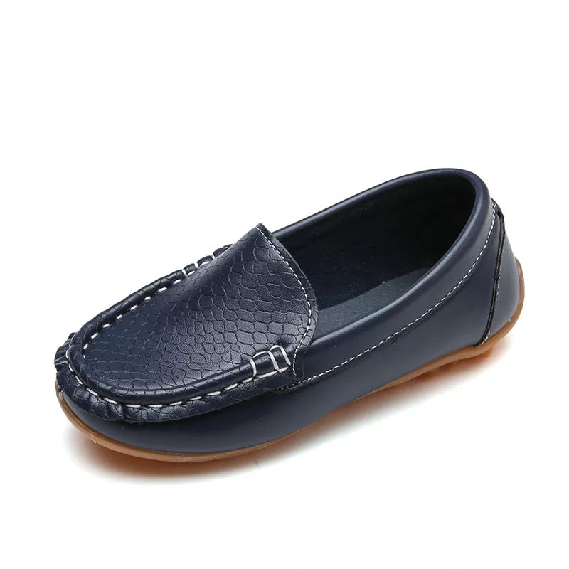 Collection of unisex kids' slip-on loafers in various colors. Breathable and comfortable toddler shoes.