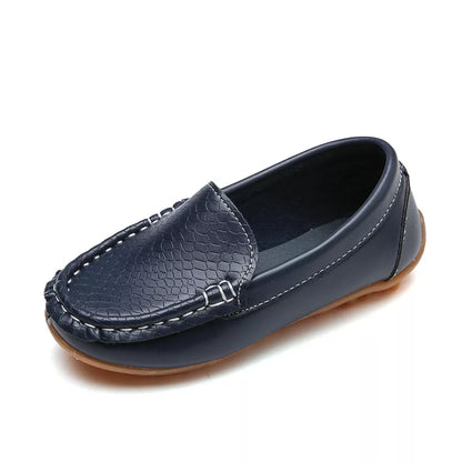 Collection of unisex kids' slip-on loafers in various colors. Breathable and comfortable toddler shoes.