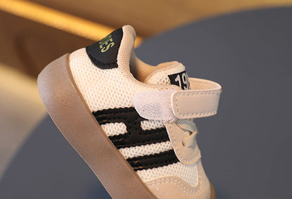 Breathable kids' sneakers with convenient velcro fasteners, perfect for active toddlers and children.