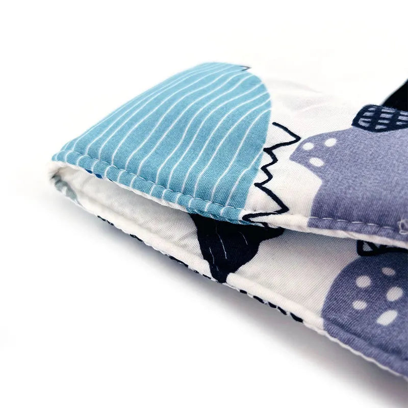 Unisex grey car seat head support pillow, featuring a secure strap for baby safety.