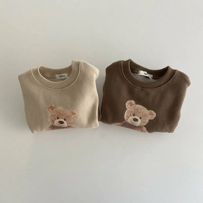 Toddler's cozy cotton hoodie with playful cartoon design for baby fashion