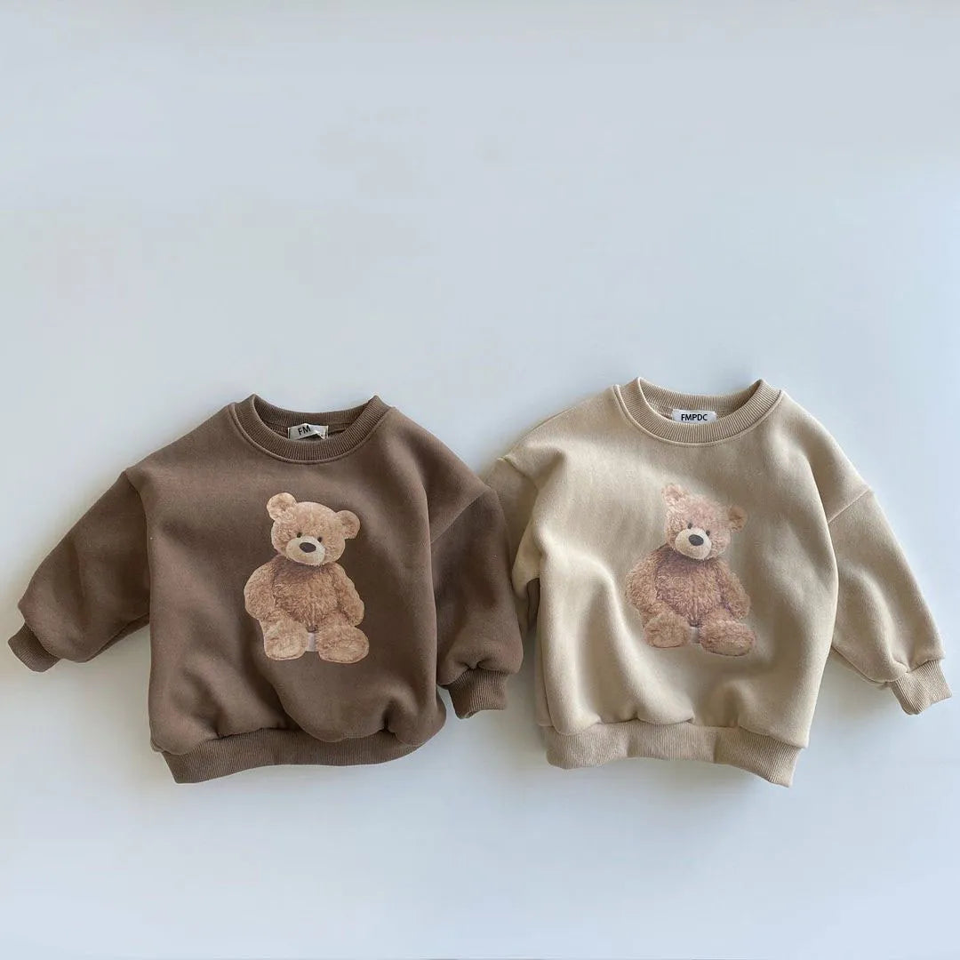 Unisex kids' autumn wear: a warm cotton hoodie with fun cartoon graphics