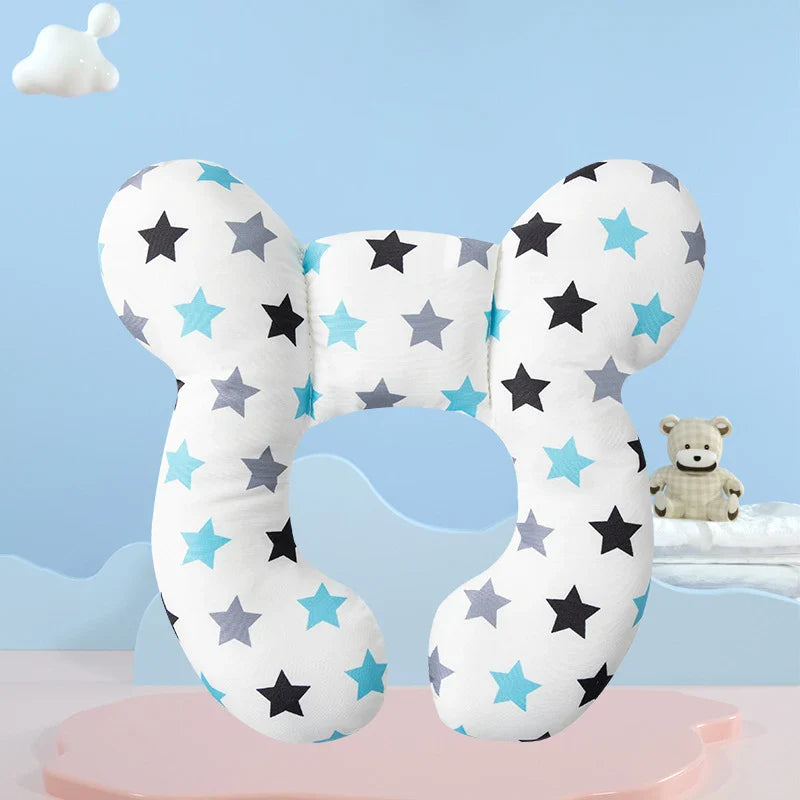 Plush U-shaped infant neck pillow with a vibrant cartoon print for head and neck comfort