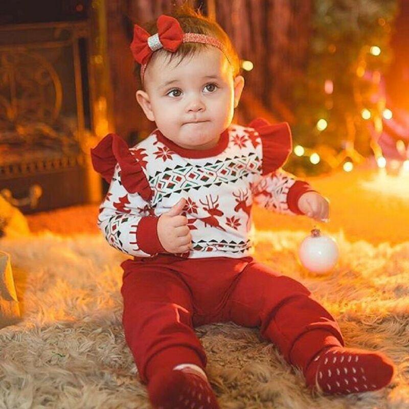 Cute bow headband, an accessory included with the unisex kids' festive Christmas outfit set.