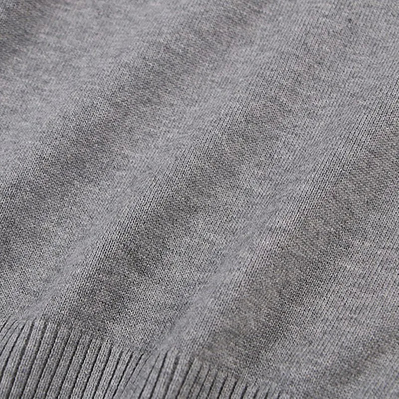 Happy child in a Unisex chunky cable knit pullover, cozy fall fashion