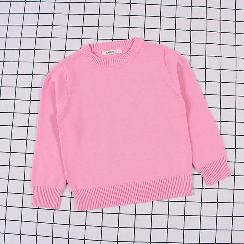 Close-up of the thick cable knit texture on a kids' autumn pullover