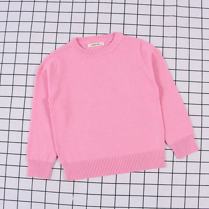 Close-up of the thick cable knit texture on a kids' autumn pullover