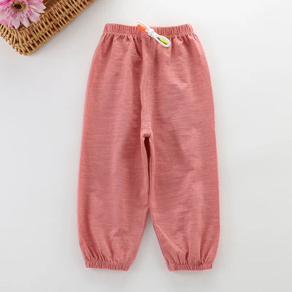 Toddler in unisex cotton blend summer pants, running outdoors, bright yellow, breathable fabric