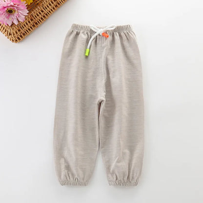Unisex children's fashion cotton summer pants, vibrant green, breathable material for sunny days