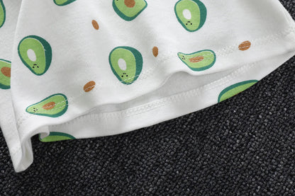 Infant pajama set, unisex and cotton, with a playful cartoon pattern on light background