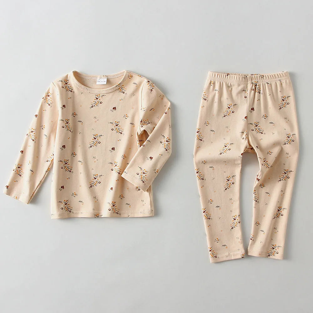 Kids' spring/autumn pajama top featuring a fun space-themed print, made from 100% breathable cotton.