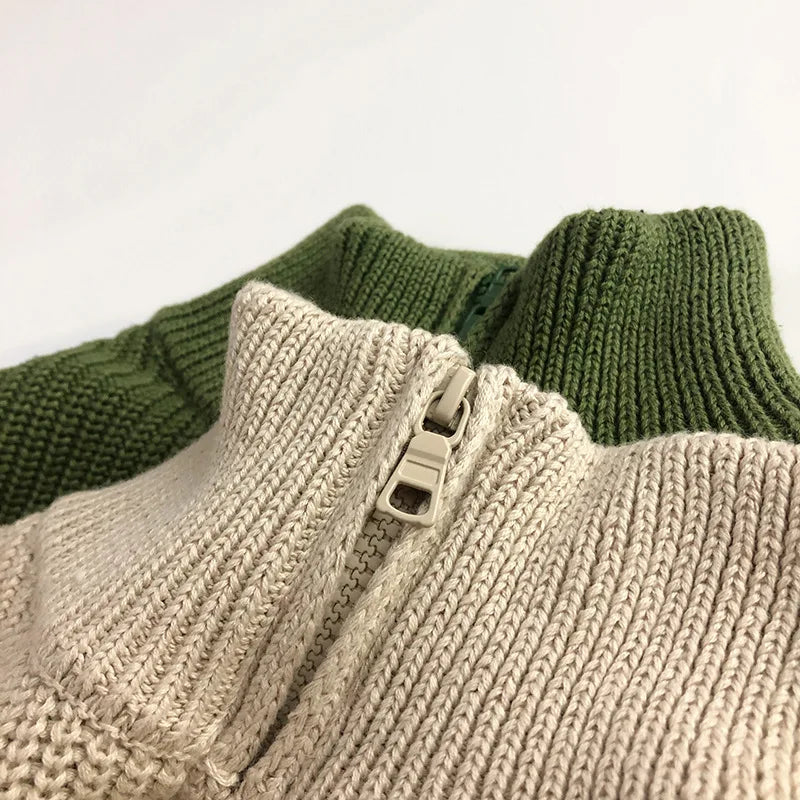 Folded grey children's zipper sweater made from soft cotton, suitable for everyday wear