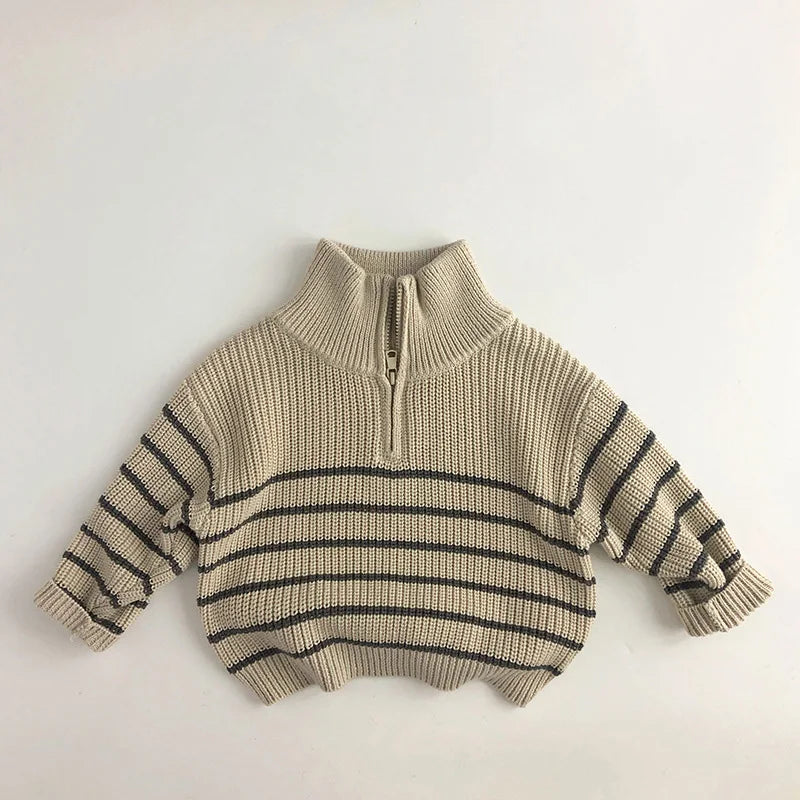 Child playing while wearing a comfortable red cotton zipper sweater, great for active toddlers