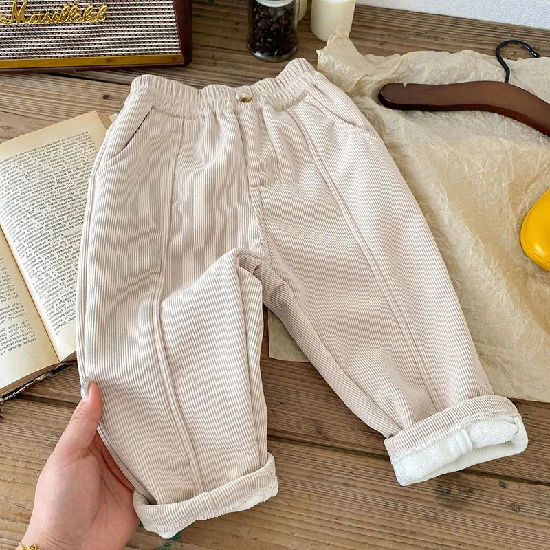 Front view of unisex kids warm corduroy pants with functional pockets