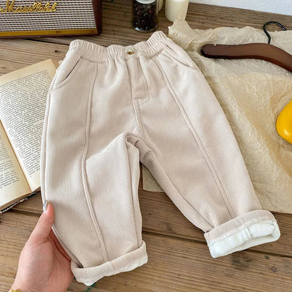 Front view of unisex kids warm corduroy pants with functional pockets
