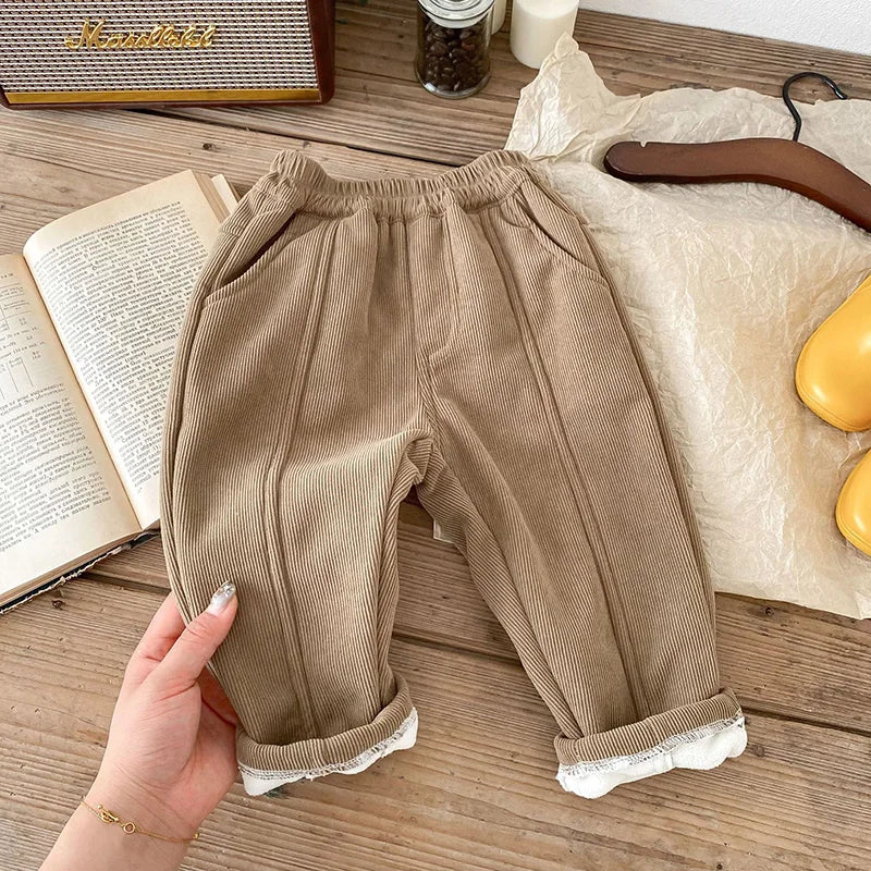 Close-up of durable corduroy fabric on unisex toddler winter fleece-lined pants