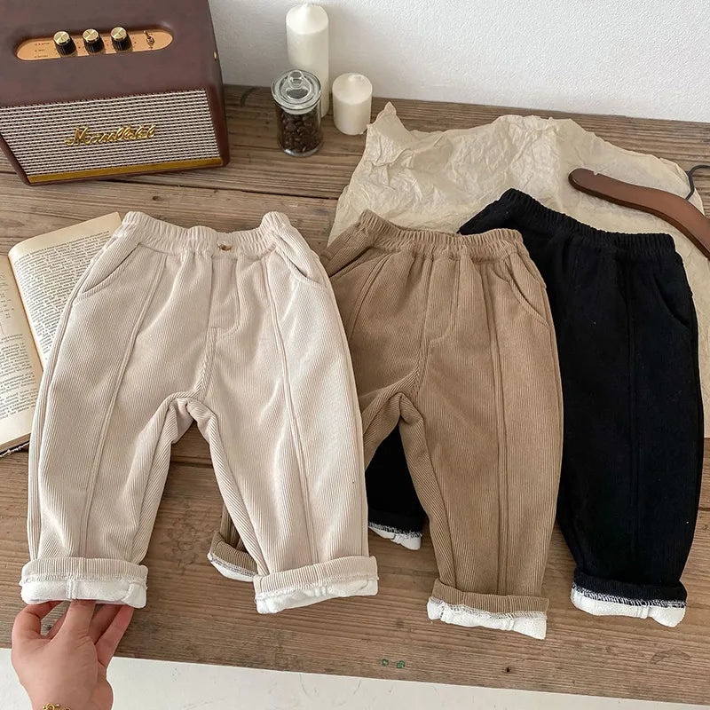 Close-up of cozy fleece lining inside unisex kids corduroy winter pants