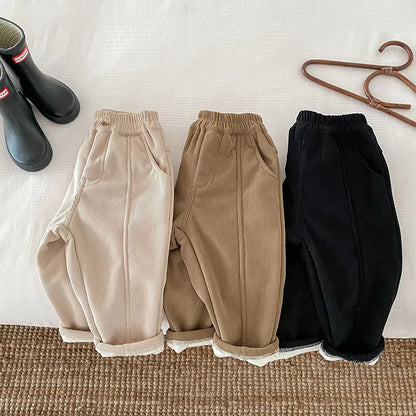 Toddler wearing unisex kids warm corduroy pants with a comfortable elastic waistband