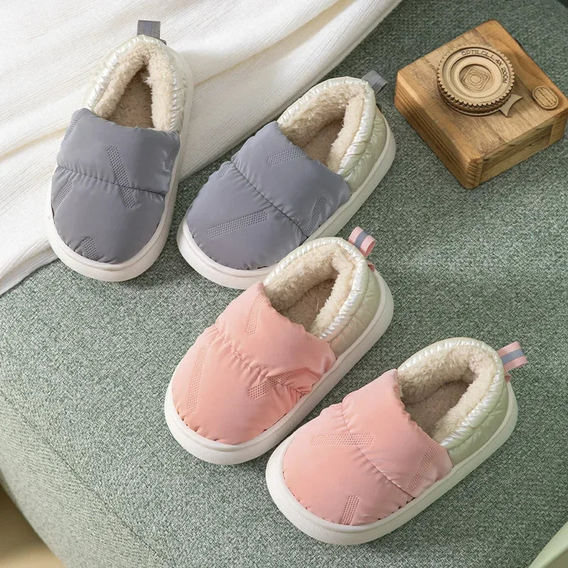 Warm toddler anti-slip slippers with soft fleece lining, ideal for winter comfort and safety.