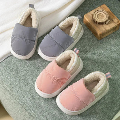 Warm toddler anti-slip slippers with soft fleece lining, ideal for winter comfort and safety.