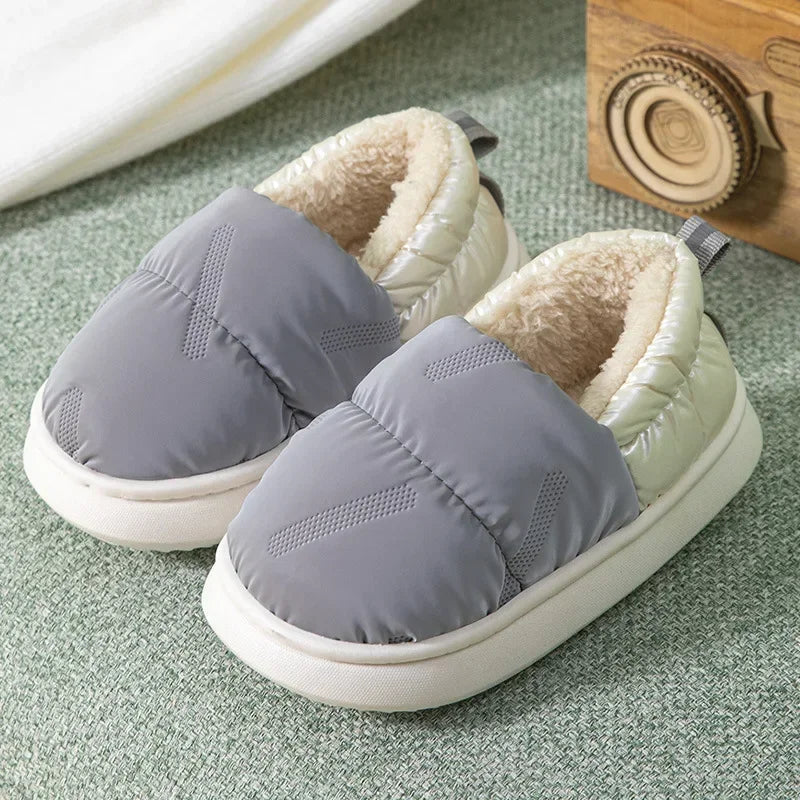 Soft interior fleece-lined anti-slip toddler slippers, designed for warmth and stability on indoor surfaces.